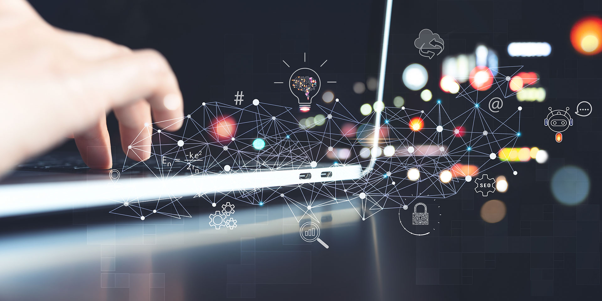 A hand is shown typing on a laptop, technology items are shown superimposed on the image.